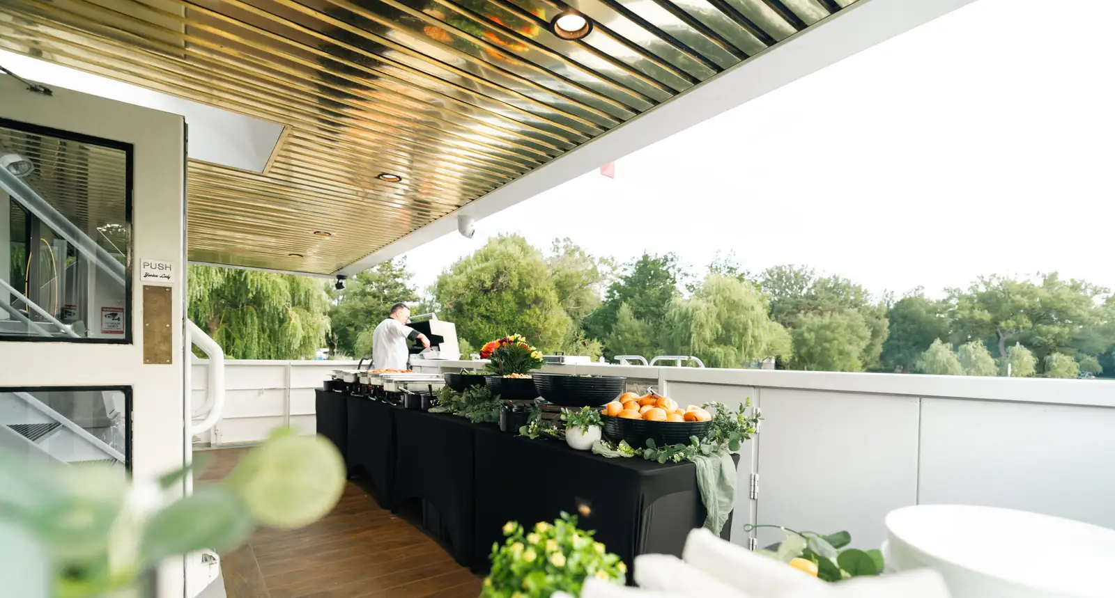 Catered buffet arranged on the outdoor deck